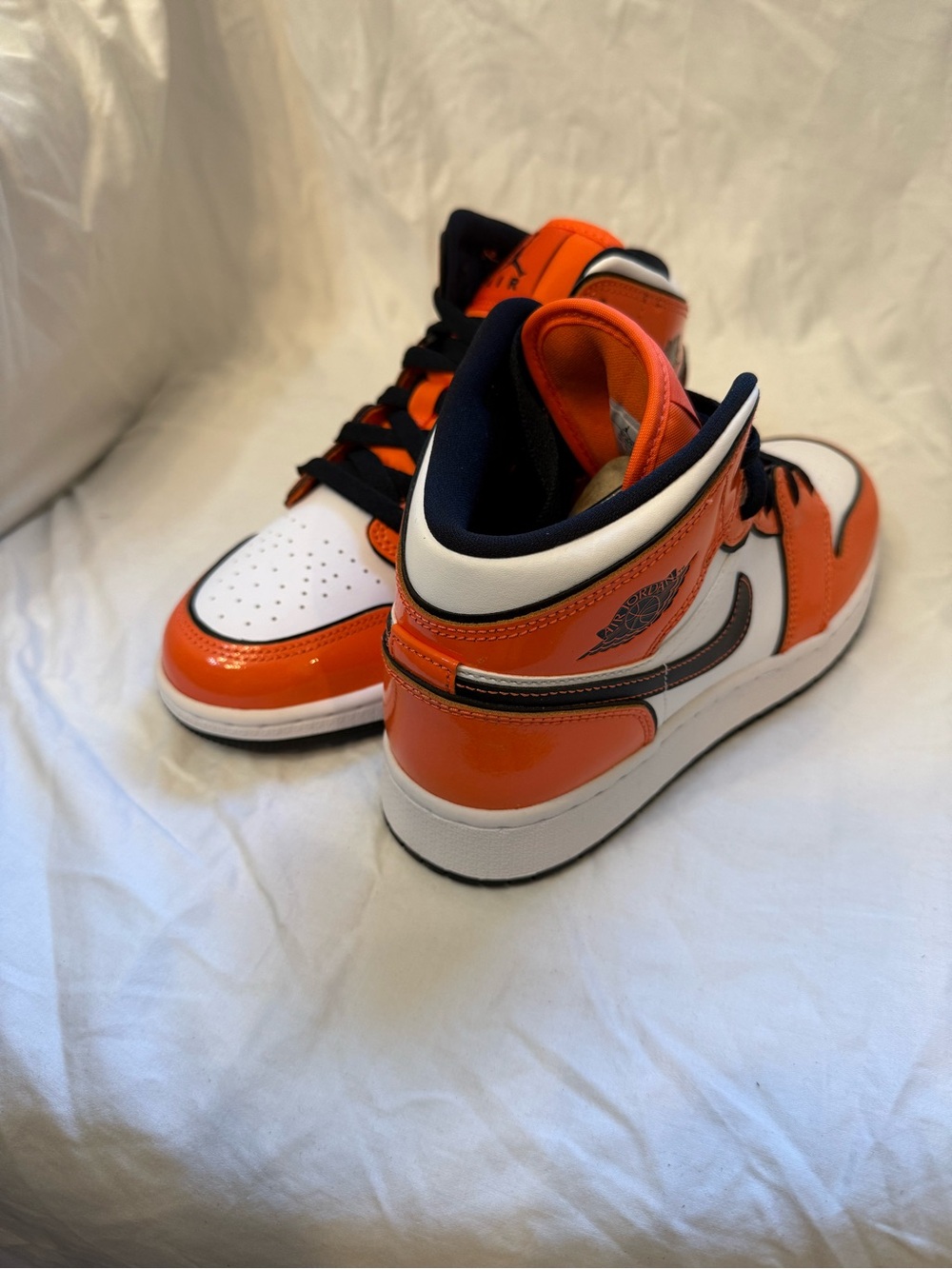 Women’s size 7/ Kids size 5.5Y Air Jordan 1 Mid.  Turf Orange/Black white.  NWB